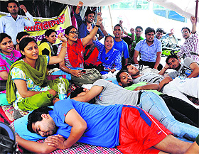 Contractual polytechnic teachers during a protest at the Parade Ground in Dehradun on Wednesday.