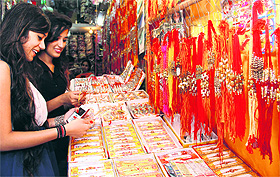 Girls buy rakhis for the Raksha Bandhan festival at Paltan Bazaar in Dehradun on Wednesday.