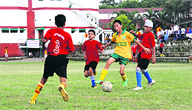 Young footballers in action during a match in the 30th Carbery Memorial Football Tournament at Col. Brown School in Dehradun on Wednesday.