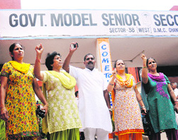 Members of the Nari Jagriti Manch hold a protest at Government Model Senior Secondary School, Sector 38 (West), Chandigarh, on Thursday.