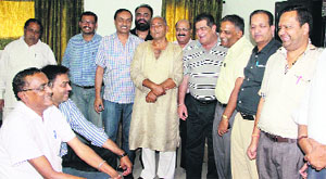 Traders wait for their turn to appear before the Additional Excise and Taxation Commissioner in Jalandhar on Thursday.