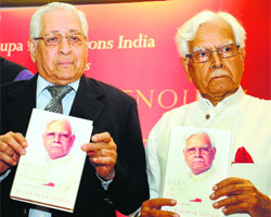 Former Congress leader Natwar Singh (right) with former Attorney General Soli Sorabjee releasing his biography One life is not enough in New Delhi on Thursday.