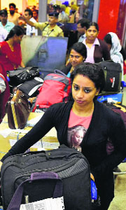 Indians evacuated from Libya on their arrival at Delhi airport on Thursday.