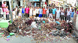 People dump garbage on a road in Abohar on Thursday