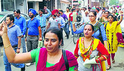 Members of the SSA/RMSA Teachers Union take out a protest march in support of their demands in Patiala on Thursday