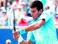 Novak Djokovic returns to Gael Monfils during the Rogers Cup in Toronto on Wednesday