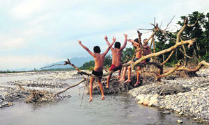 Children have a gala time near the Maldevta river in Dehradun on Thursday.