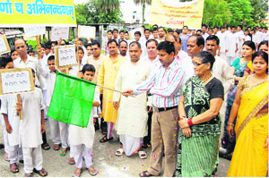 City Magistrate KK Mishra flags off Sanskrit students of Rishikul Vidyapeeth who held a rally as part of Sanskrit Week in Haridwar on Thursday.