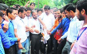 Students hold a protest at DAV PG College in Dehradun on Thursday. 