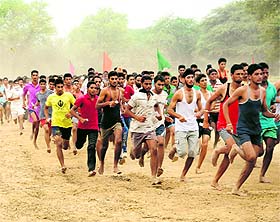 Candidates participate in 1,600m and drills to showcase strength.