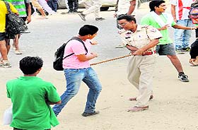 The Police use canes to keep the aspirants from blocking the Bathinda-Barnala road during the Army recruitment drive at the Bathinda Cantonment on Friday