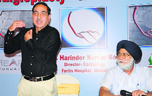 Cardiologist Dr HK Bali (left) at a press conference in Chandigarh on Friday.