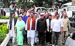 Former Chief Minister Prem Kumar Dhumal with other BJP MLAs come out of the Vidhan Sabha after the adjournment of the monsoon session in Shimla on Friday