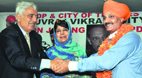 PDP patron Mufti Mohammad Sayeed and president Mehbooba Mufti welcome Vikramaditya Singh into the party fold in Jammu on Friday. 