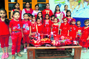 Children wear red clothes at a theme party at Sri Guru Gobind Singh Public Higher Secondary School, Kunjwani, Jammu, on Friday.