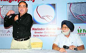 Cardiologist Dr HK Bali (left) at a press conference in Chandigarh on Friday