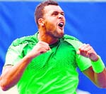 Jo-Wilfried Tsonga celebrates his win against Novak Djokovic in the third round of the Rogers Cup in Toronto on Thursday. AFP