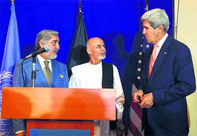 US Secretary of State John Kerry (R) with Afghan presidential candidates Ashraf Ghani and Abdullah Abdullah (L) during a news conference in Kabul on Friday.