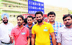 NSUI state president Dalsharan Singh (in red T-shirt) outside DAV College, Sector 10, Chandigarh, on Saturday