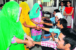 HIV positive women tie rakhis to boys at Panjab University on Saturday