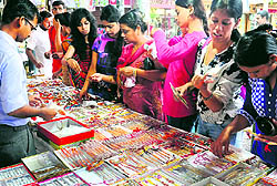 Customers buy rakhis on the eve of Raksha Bandhan in Chandigarh on Saturday