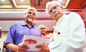 Natwar Singh signing his autobiography ‘One Life is not Enough’ for Sanjaya Baru before its release in New Delhi on Thursday.