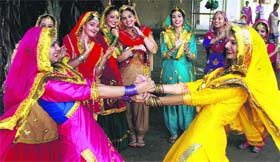 Students of HMV College perform Gidha during Teej celebrations on the college campus in Jalandhar on Saturday.