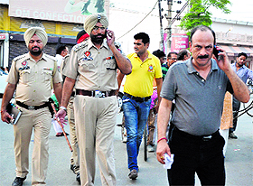 The car owner and police officials at Hambran Road in Ludhiana. 