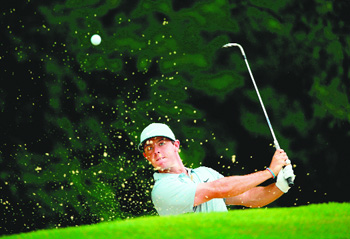 Rory McIlroy hits out of the bunker on the third hole during the second round of the PGA Championship in Louisville, Kentucky, on Friday.