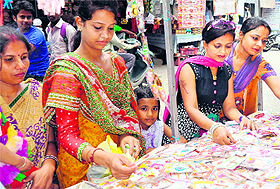 Women buy rakhis from a shop in Haridwar on Saturday.