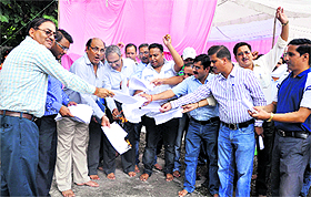 Diploma engineers burn copies of transfer orders in Dehradun on Friday.