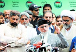 Muhammad Tahirul Qadri, Sufi cleric and leader of political party Pakistan Awami Tehreek, addresses a press conference in Lahore on Saturday. Reuters