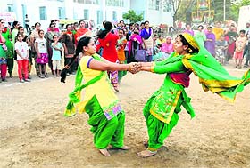 Girls perform the Kikli dance during a function at Jaipalgarh village in Bathinda on Sunday.