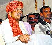 Congress leader Birender Singh addresses a meeting in Rohtak on Sunday
