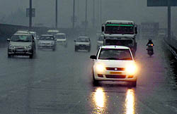 Vehicles being driven at a snails pace due to rain on National Highway 8 in Gurgaon on Sunday