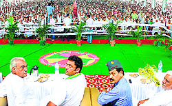 Chief Minister Bhupinder Singh Hooda (left) with other party members at the Ex-Servicemen Sammelan in Jhajjar on Sunday