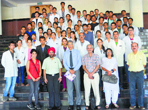 Students and Principal Anil Chauhan with IDPD general secretary Arun Mitra on the occasion of Nagasaki Day in Kangra on Saturday