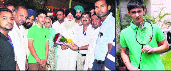 Jeevesh Khanna being honoured by Punjab cabinet Minister Tota Singh at Moga on Sunday; and (right) shuttler Jeevesh raring to go.