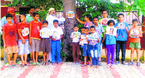 Members of the Gau Vansh Cell of the BJP and children celebrate Raksha Bandhan by tying rakhis on a tree