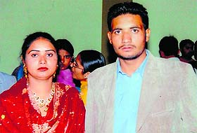 (Top) A file photo of Gurpinder Kaur with her brother Manjinder Singh; and Amarjit Kaur shows her brother Kanwaljit Singhs picture. Both the youths are stuck in Iraq. 