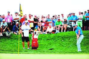 Rory McIlroy chips onto the 12th green during the third round of the PGA Championship in Louisville, Kentucky, on Saturday