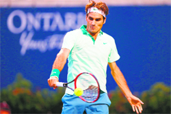 Roger Federer returns to Feliciano Lopez in the semifinals of the Rogers Cup in Toronto on Saturday.