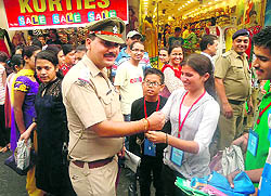 A member of the U-Turn Foundation ties a rakhi on the wrist of a police official in Dehradun on Sunday