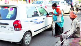 A woman beggar seeks alms at Lawrence Road in Amritsar.