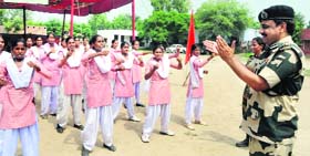 Girl students undergo self-defence training programme organised at Ballarwal village near Ajnala on Monday.