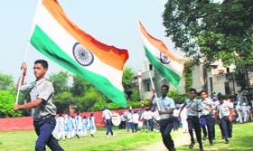 Schoolchildren take part in a rehearsal for Independence Day celebrations at Guru Nanak Stadium in Amritsar on Monday.