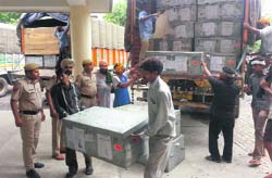 Officials offload EVMs at the Mini Secretariat in Karnal .