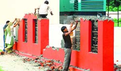 The plaques of development projects were taken from the Red Bishop Convention Centre in Sector 1, Panchkula, to their respective places on Monday. Tribune Photo: Nitin Mittal