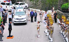 Virbhadra Singh, Chief Minister, takes guard of honour at Vidhan Sabha in Shimla on Monday.