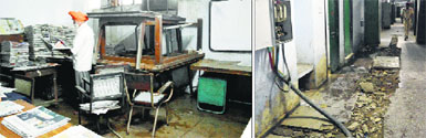 An employee stacks newspapers in the library; and (right) the dug-up corridor that awaits repair in Ludhiana.